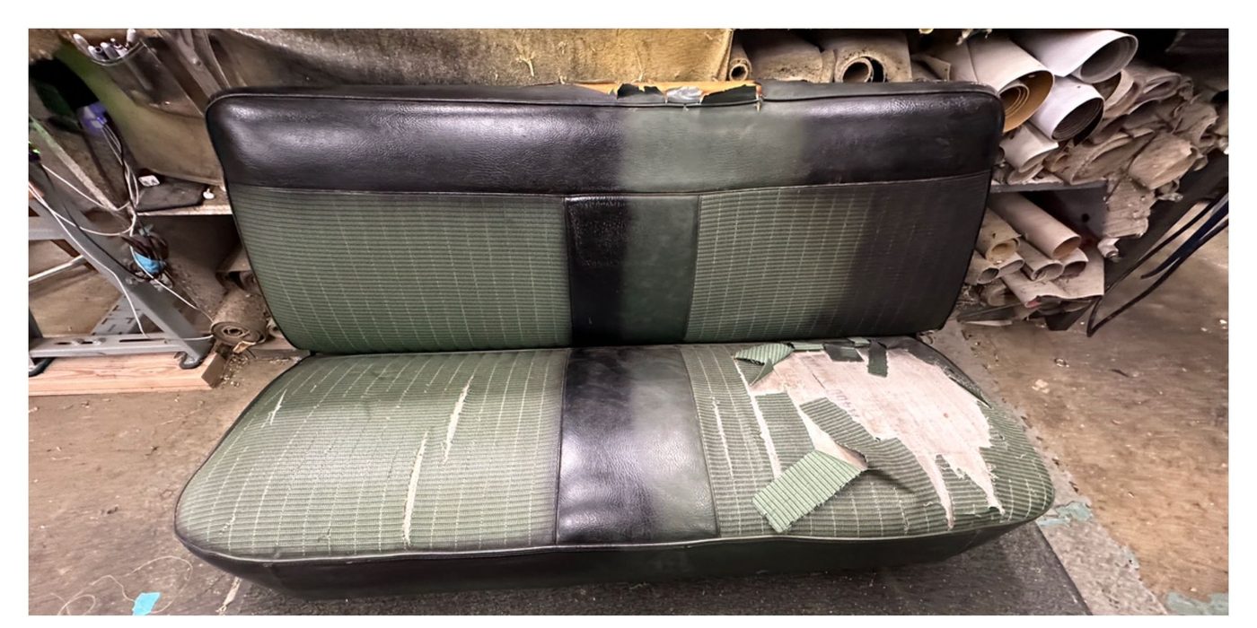 Worn, torn bench seat before restoration